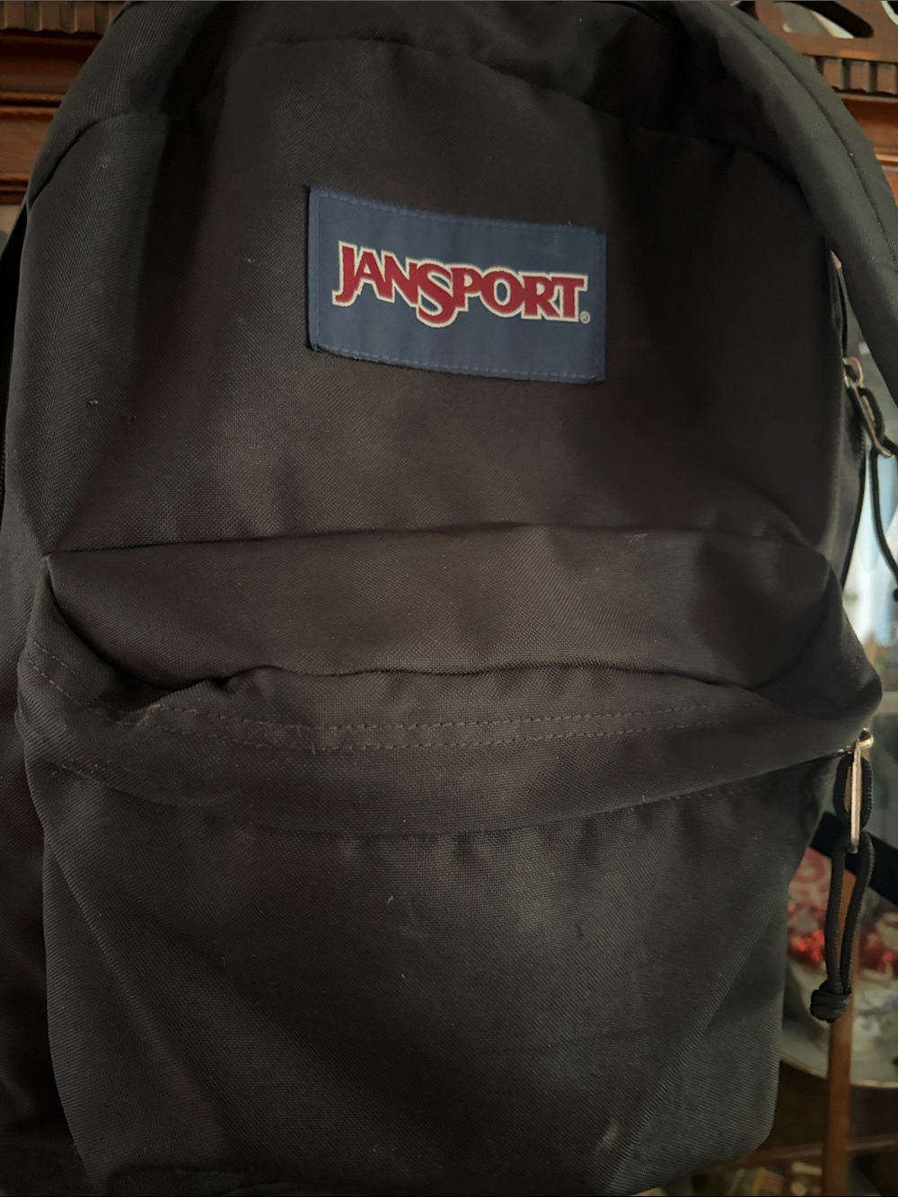 Jansport Black Backpack with Red Logo on Navy Patch